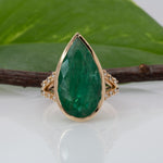 14K yellow gold Zambian emerald pear ring with diamond accents