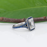 platinum lab grown diamond ring with blue sapphire accents