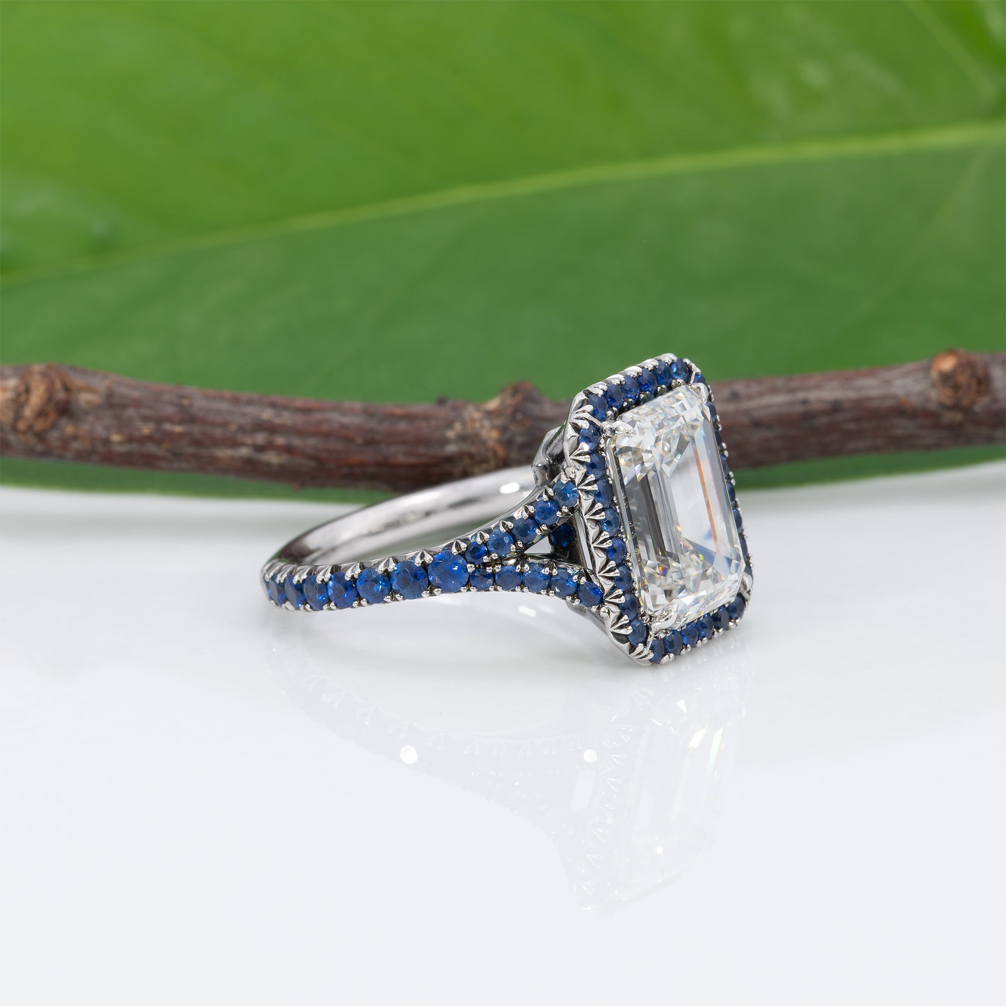 platinum lab grown diamond ring with blue sapphire accents
