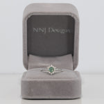 14K white gold alexandrite ring with diamond accents