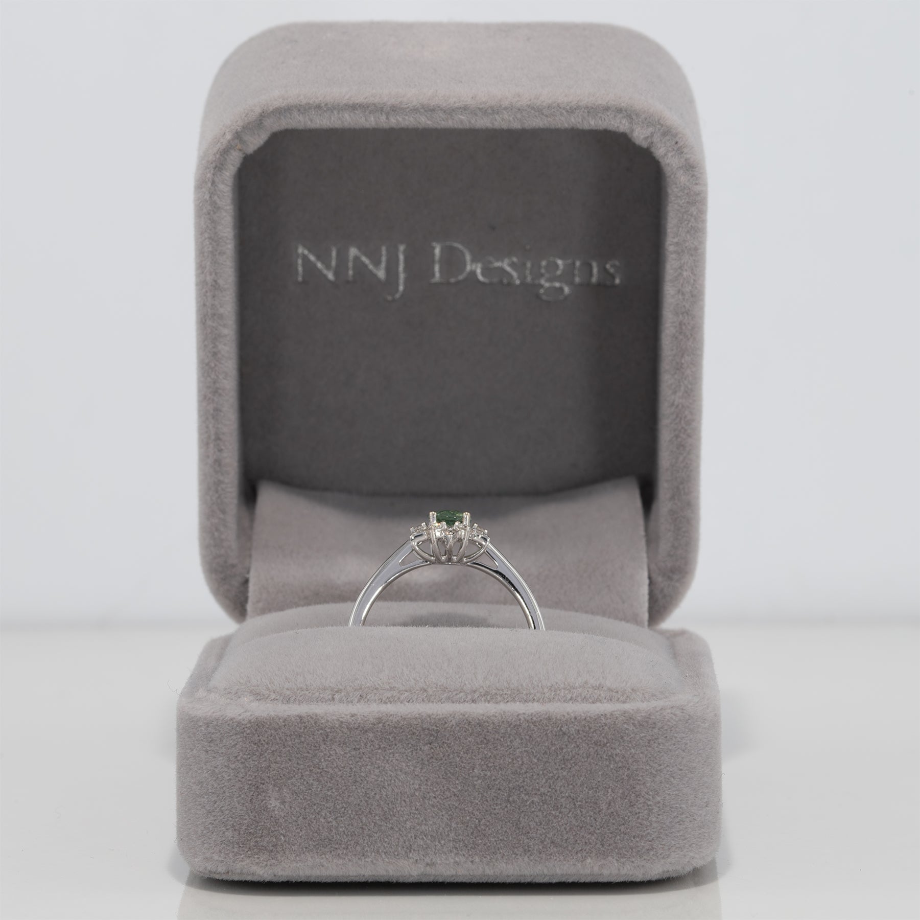 14K white gold alexandrite ring with diamond accents