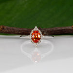 14K white gold padparadscha sapphire ring with diamond halo