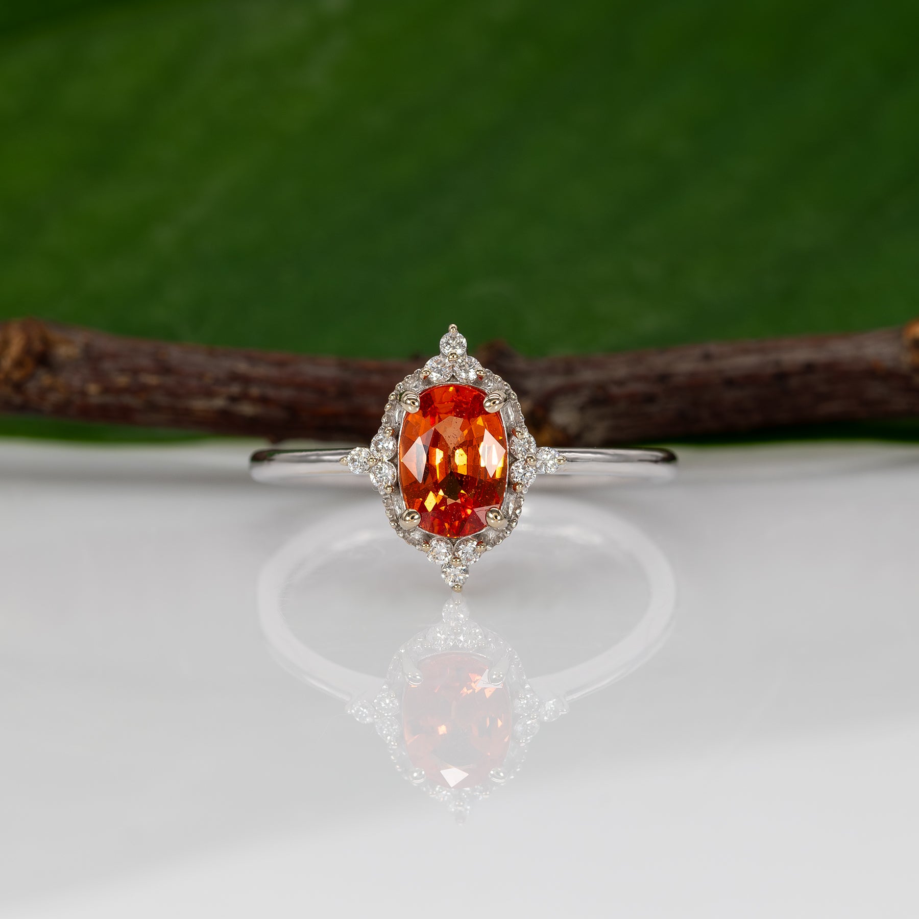 14K white gold padparadscha sapphire ring with diamond halo