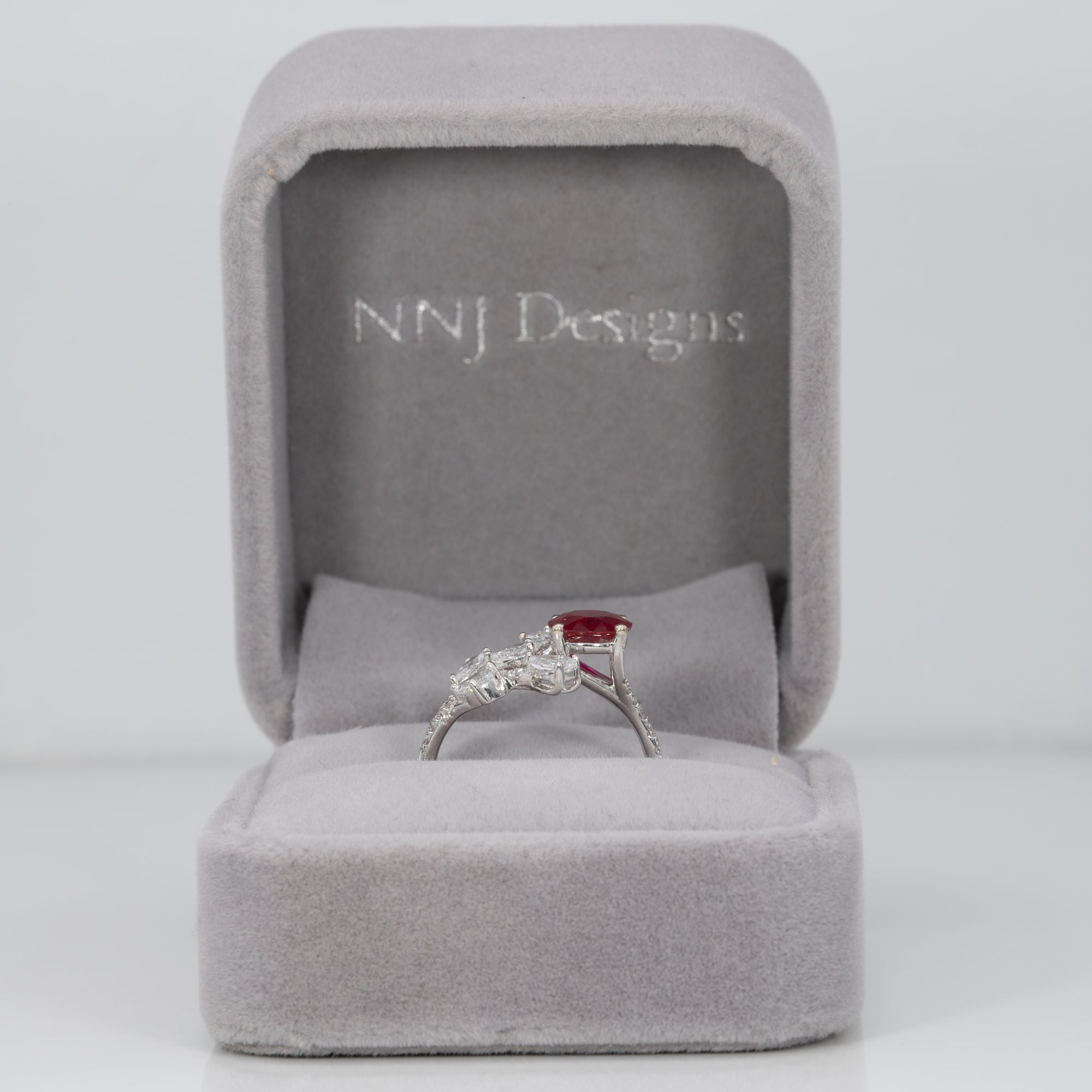 14K white gold mozambique ruby ring with diamond accents