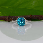 14K white gold Cambodian blue zircon cushion ring with diamond accents