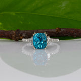 14K white gold Cambodian blue zircon cushion ring with diamond accents