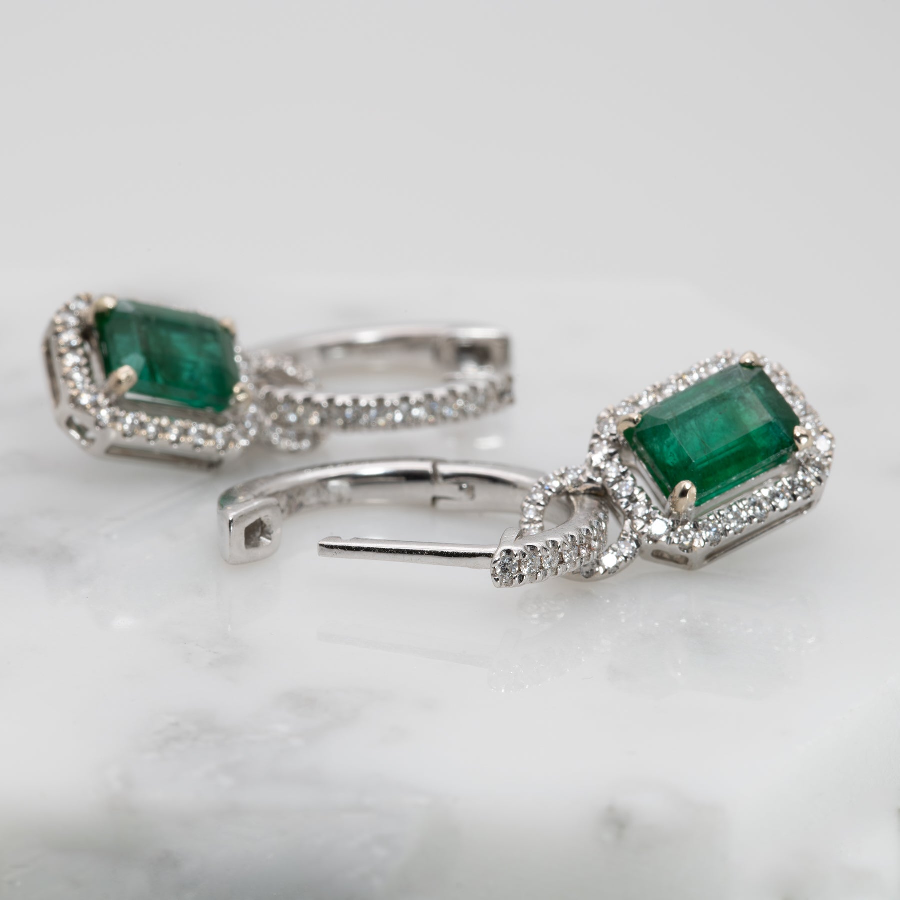 14K white gold Zambian emerald earrings with diamond halos