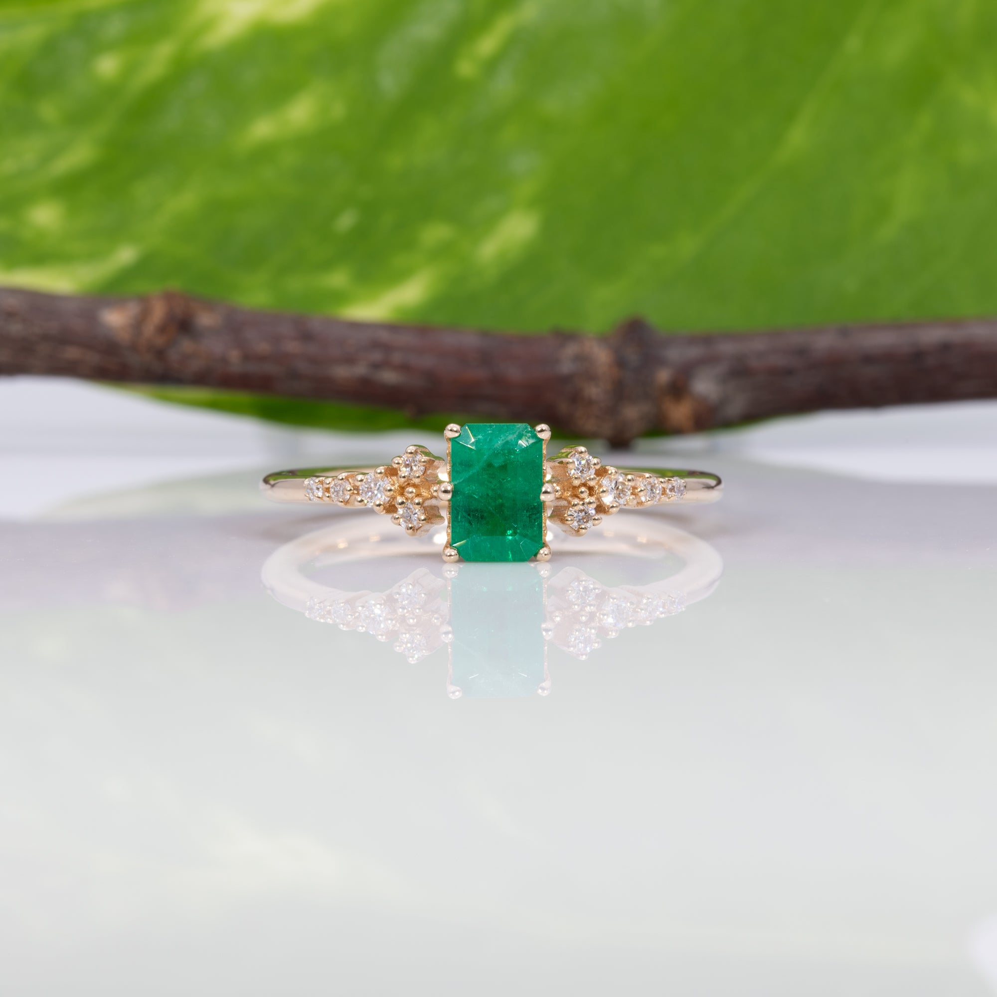 14K yellow gold colombian emerald ring with diamond accents