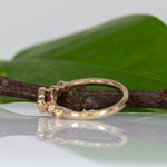14K yellow gold padparadscha sapphire oval ring with diamond accents