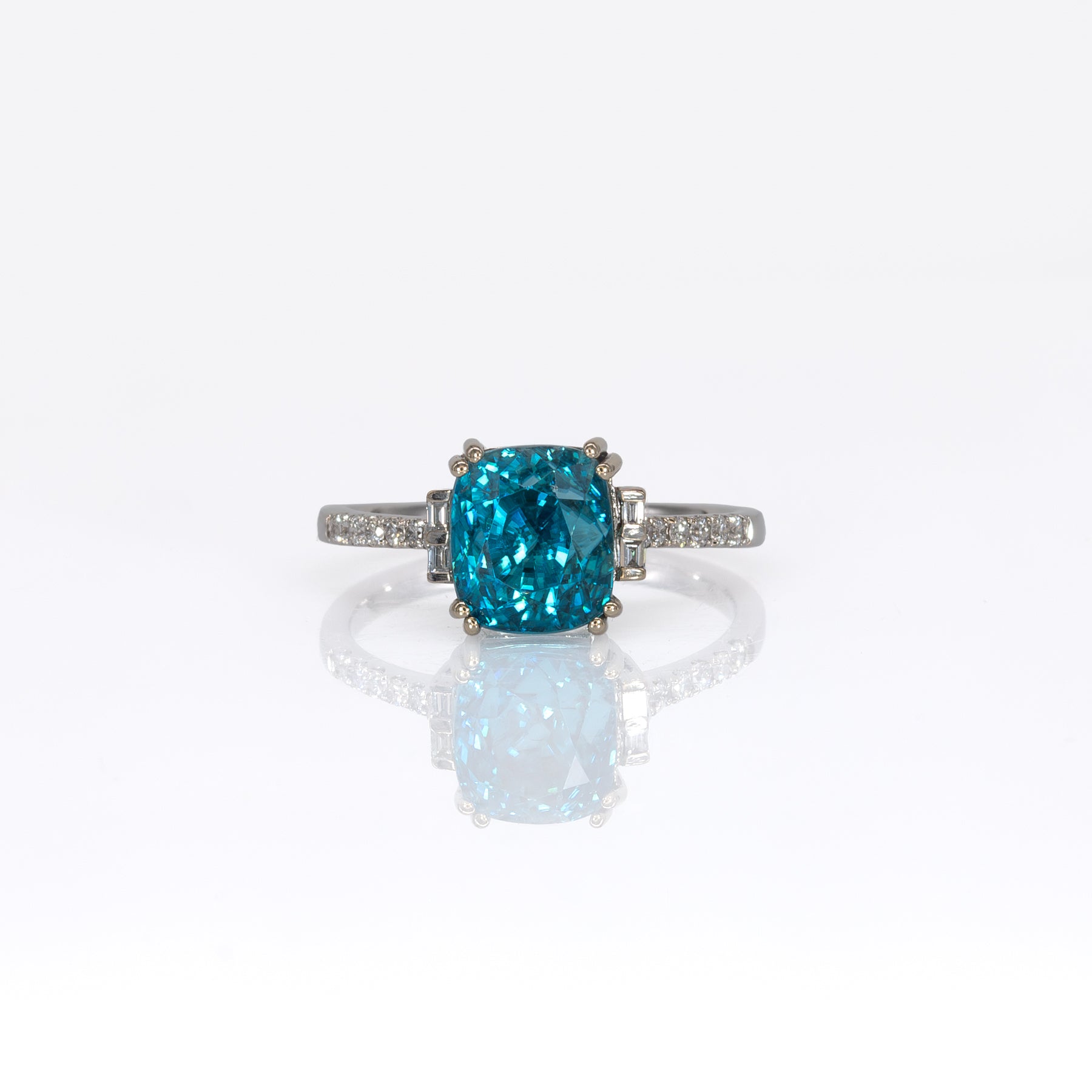 14K white gold Cambodian blue zircon cushion ring with diamond accents