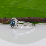 14K white gold teal sapphire oval ring with diamond halo