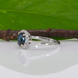 14K white gold teal sapphire oval ring with diamond halo