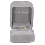 14K yellow gold padparadscha sapphire ring with diamond accents
