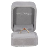 14K yellow gold padparadscha sapphire ring with diamond accents