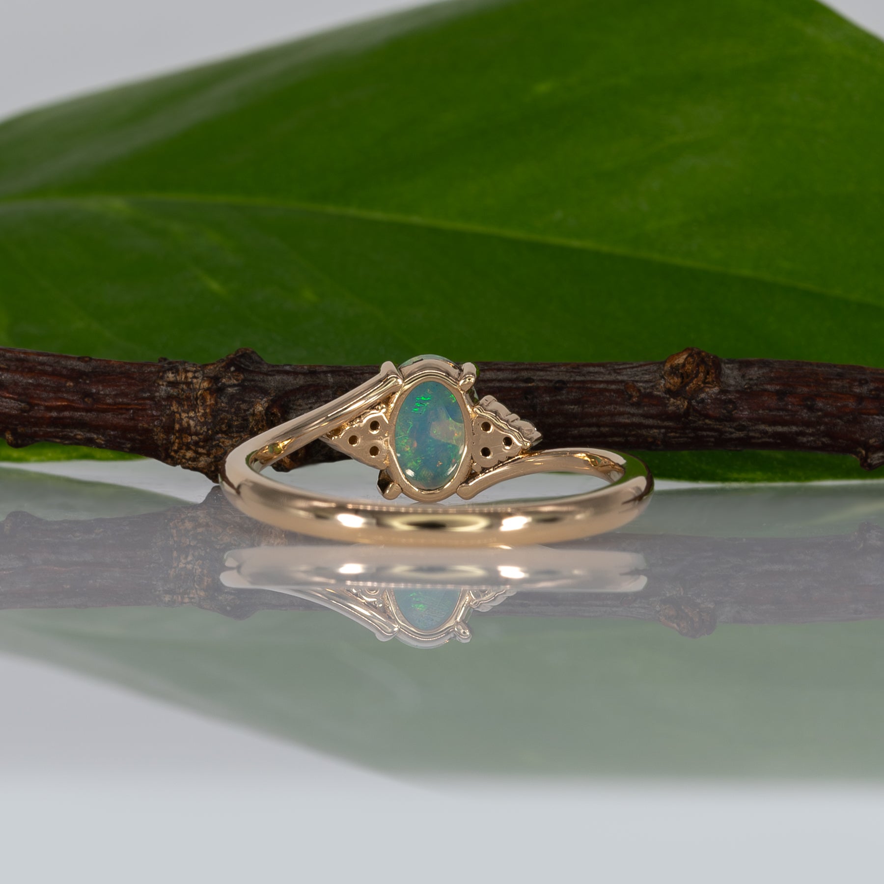 14K yellow gold Ethiopian opal cabochon ring with diamond accents