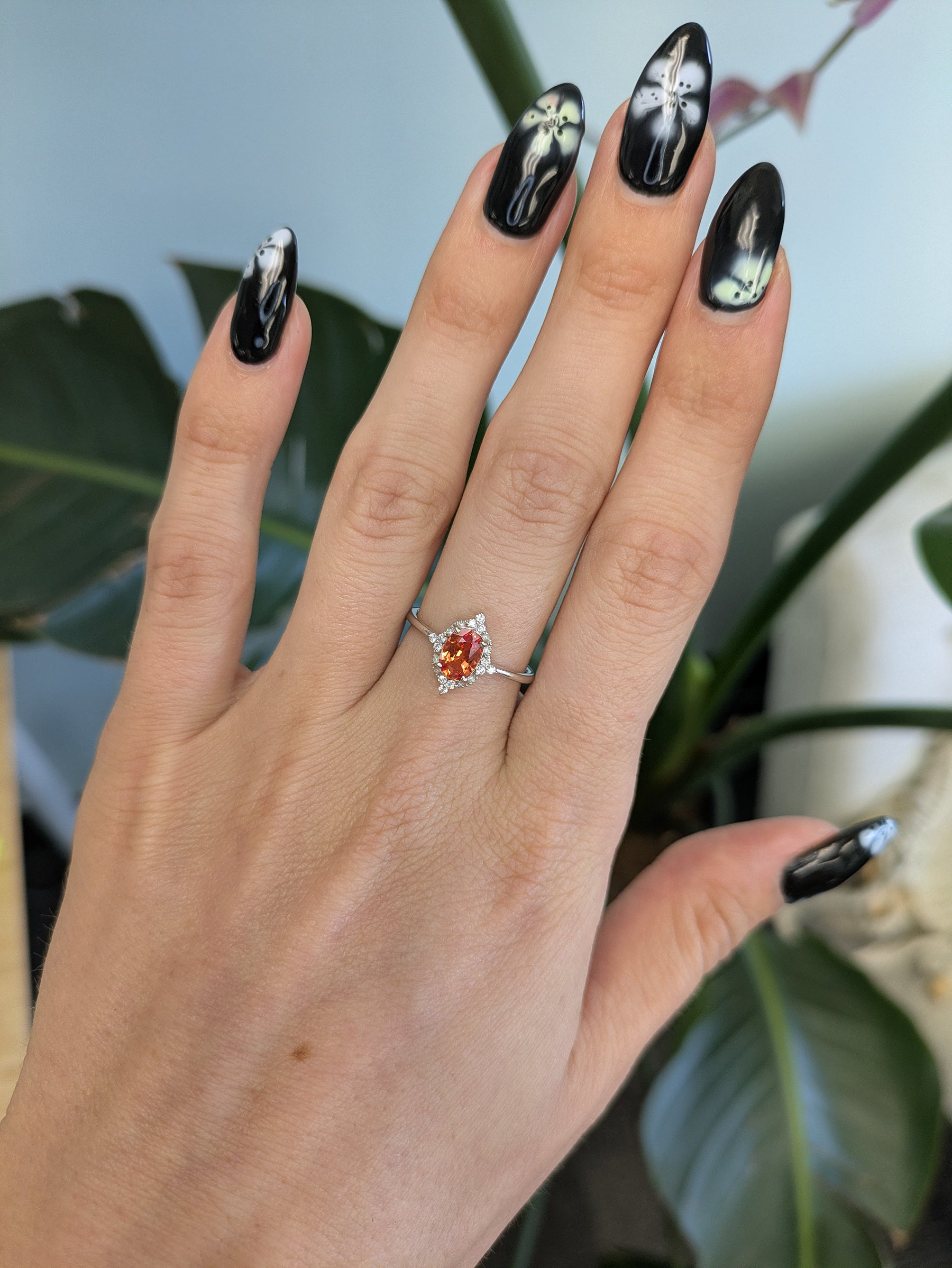14K white gold padparadscha sapphire ring with diamond halo