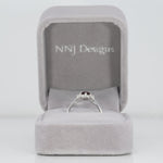 14K white gold red spinel ring with diamond halo