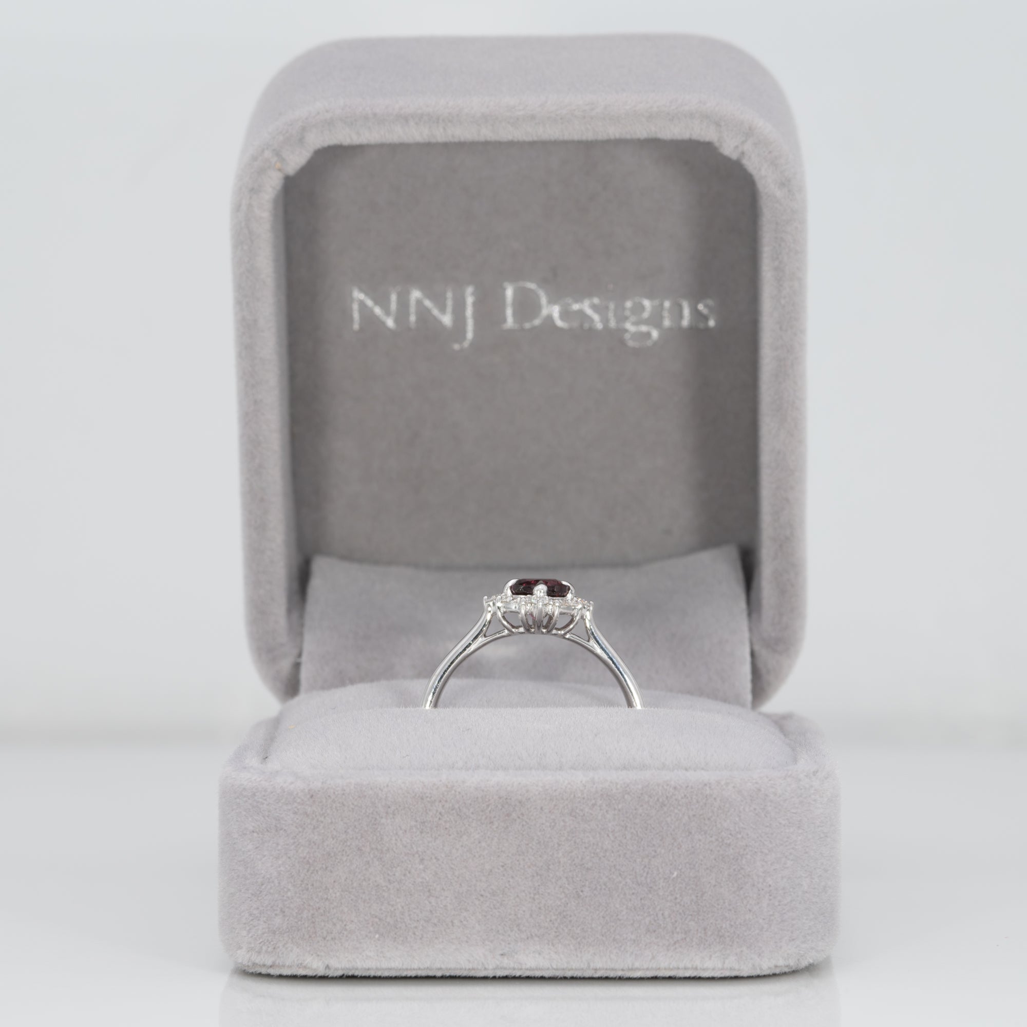 14K white gold red spinel ring with diamond halo