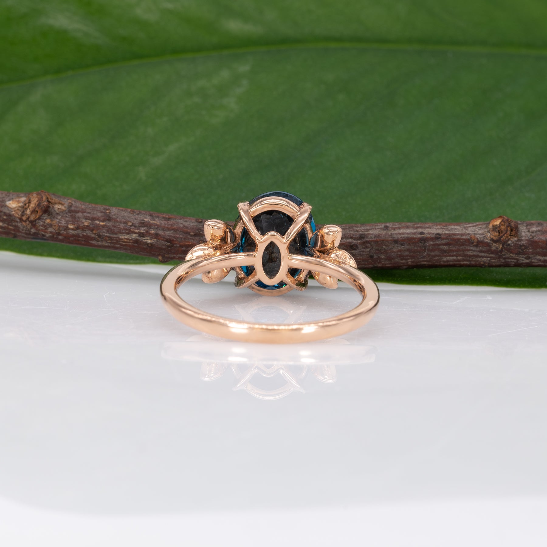 14K rose gold London blue topaz ring with diamond accents