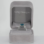 14K white gold Cambodian blue zircon cushion ring with diamond halo