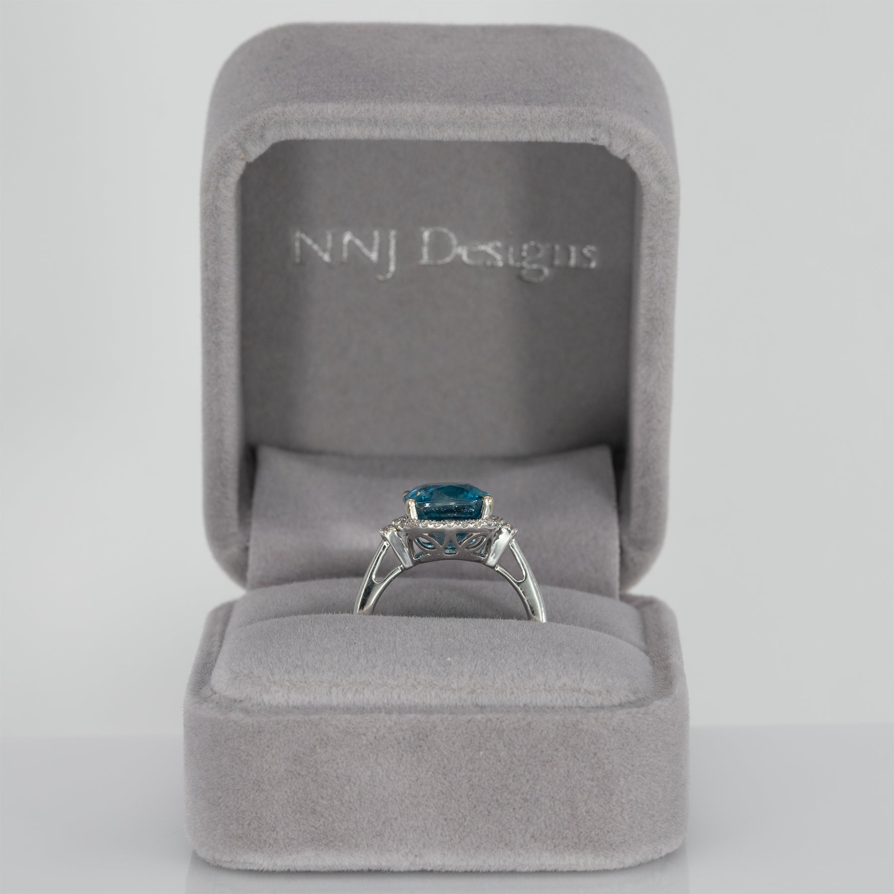 14K white gold Cambodian blue zircon cushion ring with diamond halo