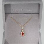 14K yellow gold padparadscha sapphire pendant
