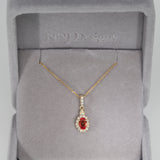 14K yellow gold padparadscha sapphire pendant