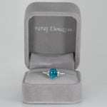 14K white gold Cambodian blue zircon cushion ring with diamond accents