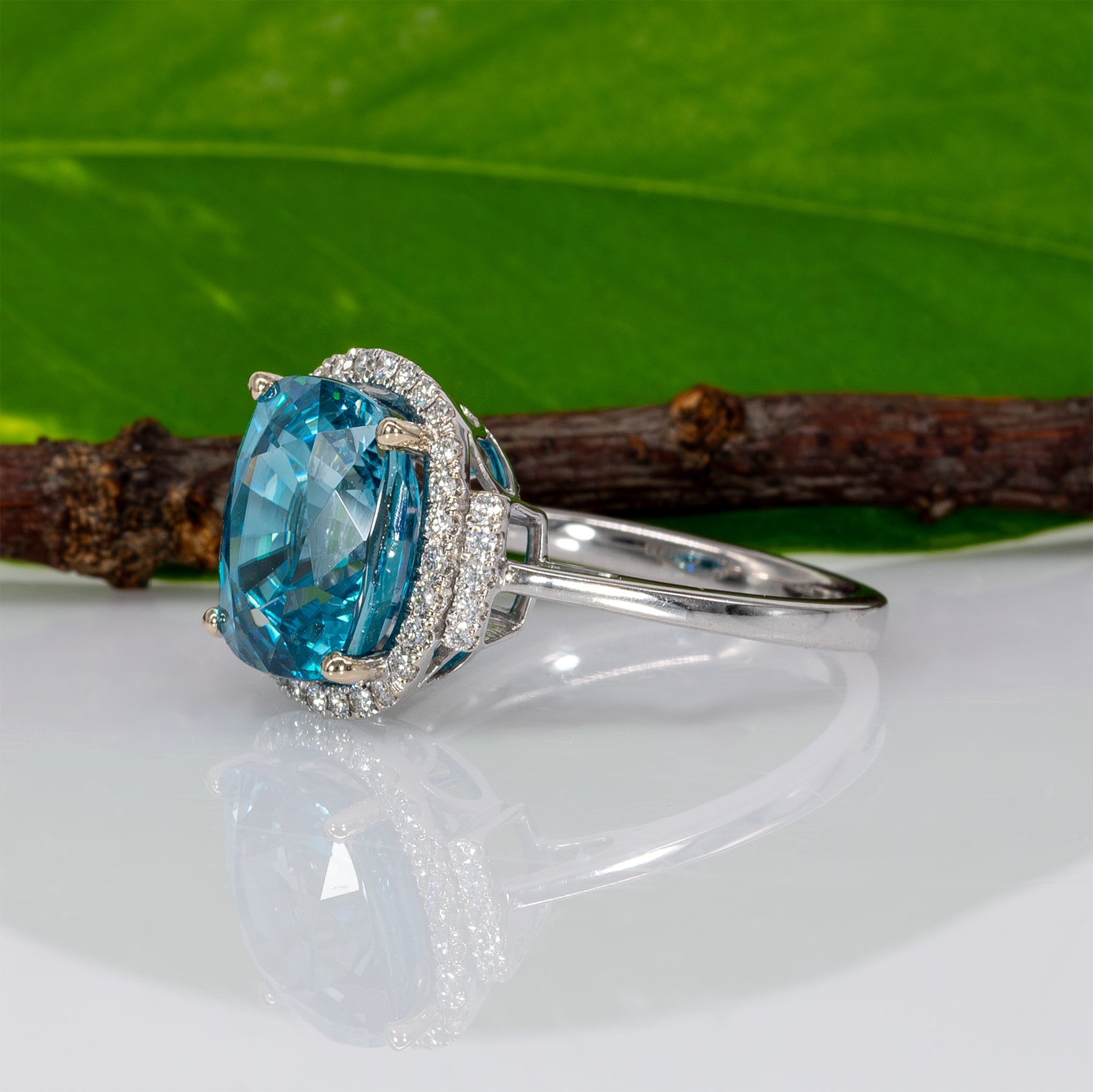 14K white gold Cambodian blue zircon cushion ring with diamond halo