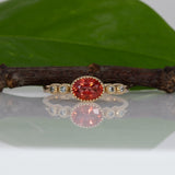 14K yellow gold padparadscha sapphire oval ring with diamond accents