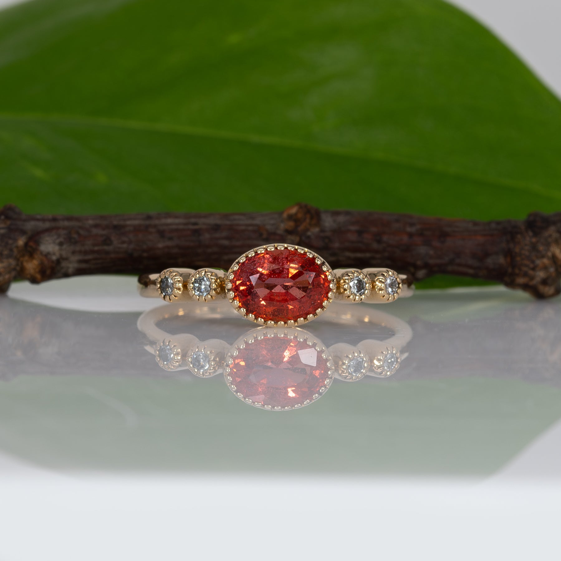 14K yellow gold padparadscha sapphire oval ring with diamond accents