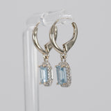 14K white gold aquamarine emerald-cut stud earrings with diamond halo