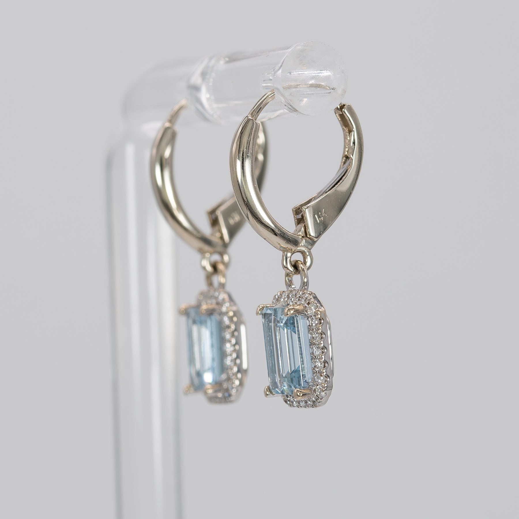 14K white gold aquamarine emerald-cut stud earrings with diamond halo