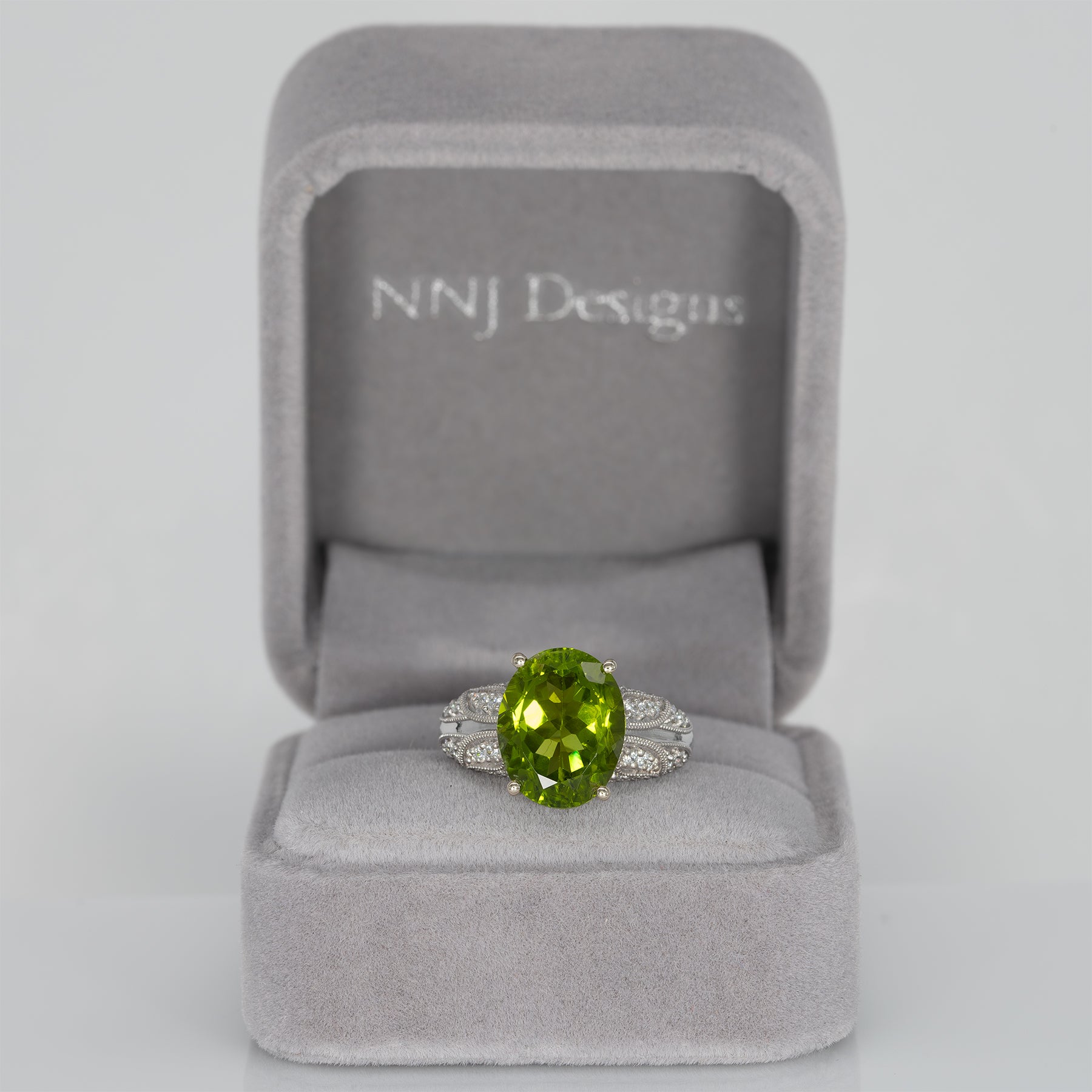 14K white gold peridot oval ring with diamond halo