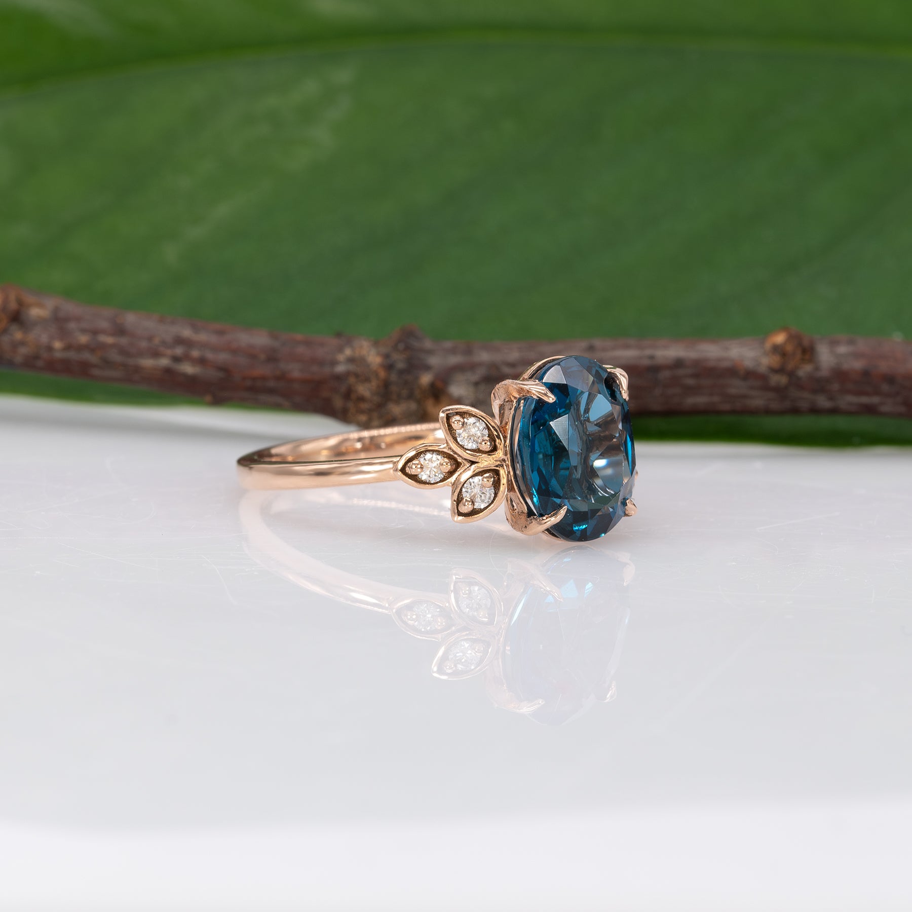 14K rose gold London blue topaz ring with diamond accents