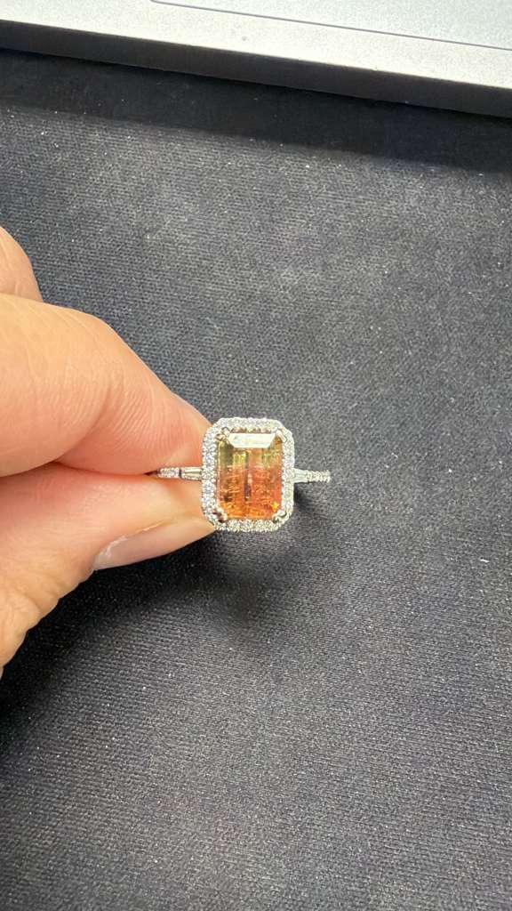 14K white gold bi-color tourmaline emerald-cut ring with diamond halo