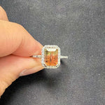14K white gold bi-color tourmaline emerald-cut ring with diamond halo