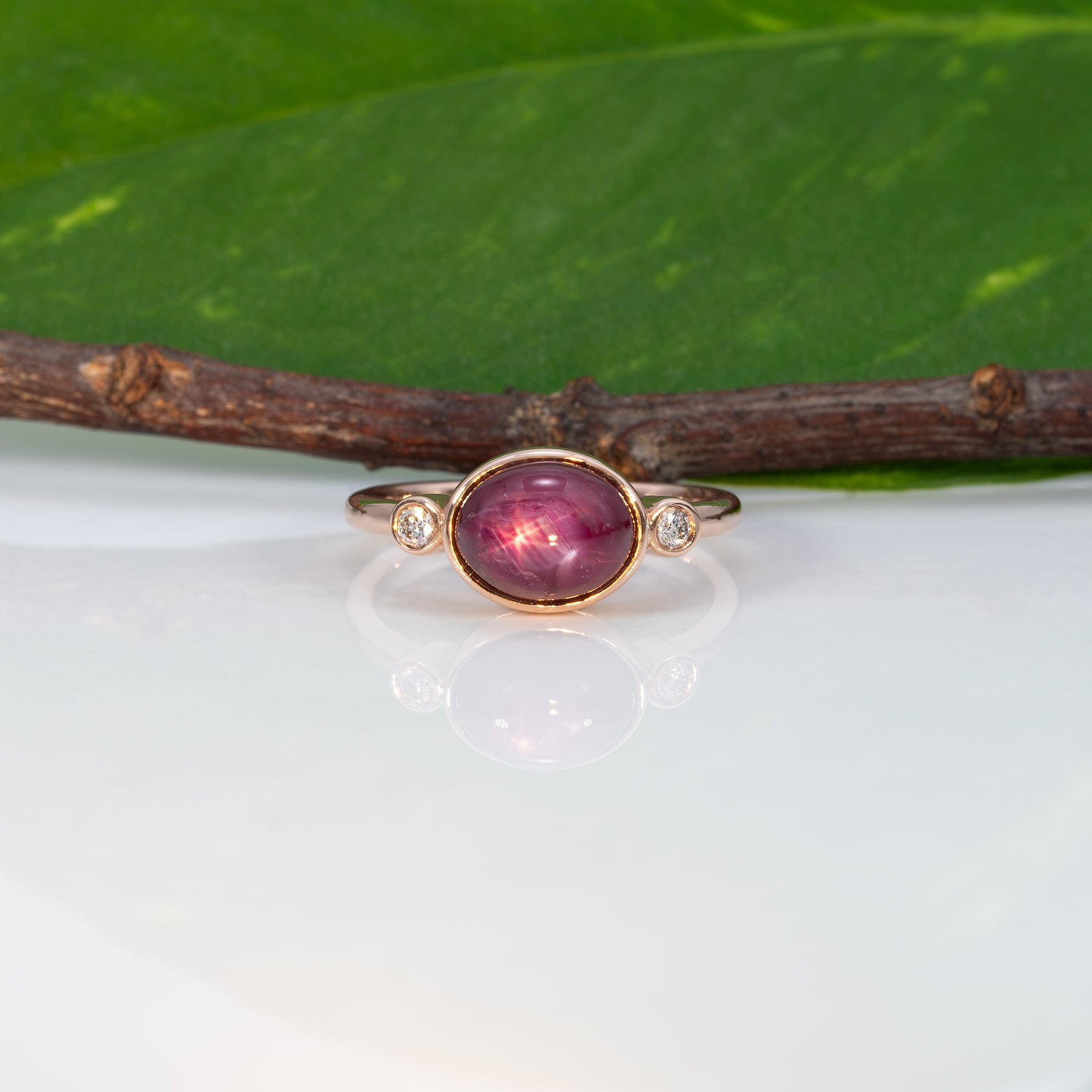 14K rose gold star ruby cabochon ring with diamond accents