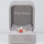 14K yellow gold padparadscha sapphire ring with diamond accents