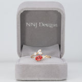 14K yellow gold padparadscha sapphire ring with diamond accents