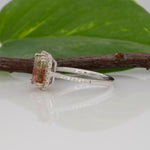 14K white gold bi-color tourmaline emerald-cut ring with diamond halo