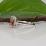 14K white gold bi-color tourmaline emerald-cut ring with diamond halo