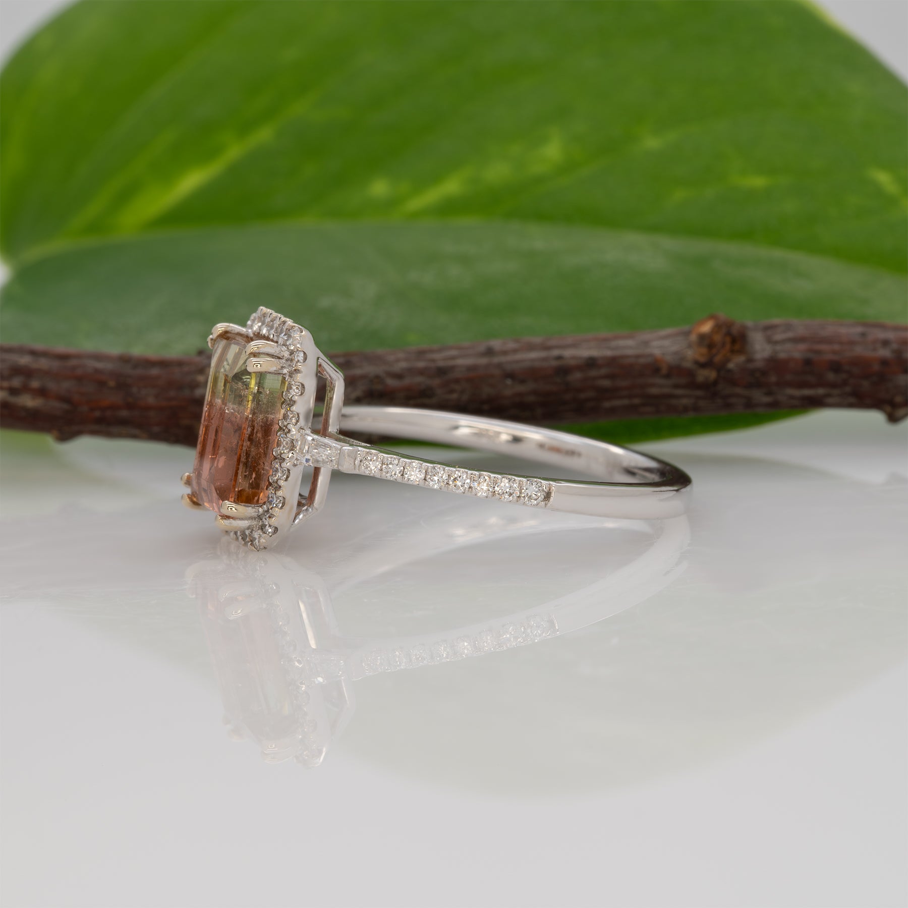 14K white gold bi-color tourmaline emerald-cut ring with diamond halo