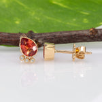 14K white gold padparadscha sapphire pear earrings with diamond accents
