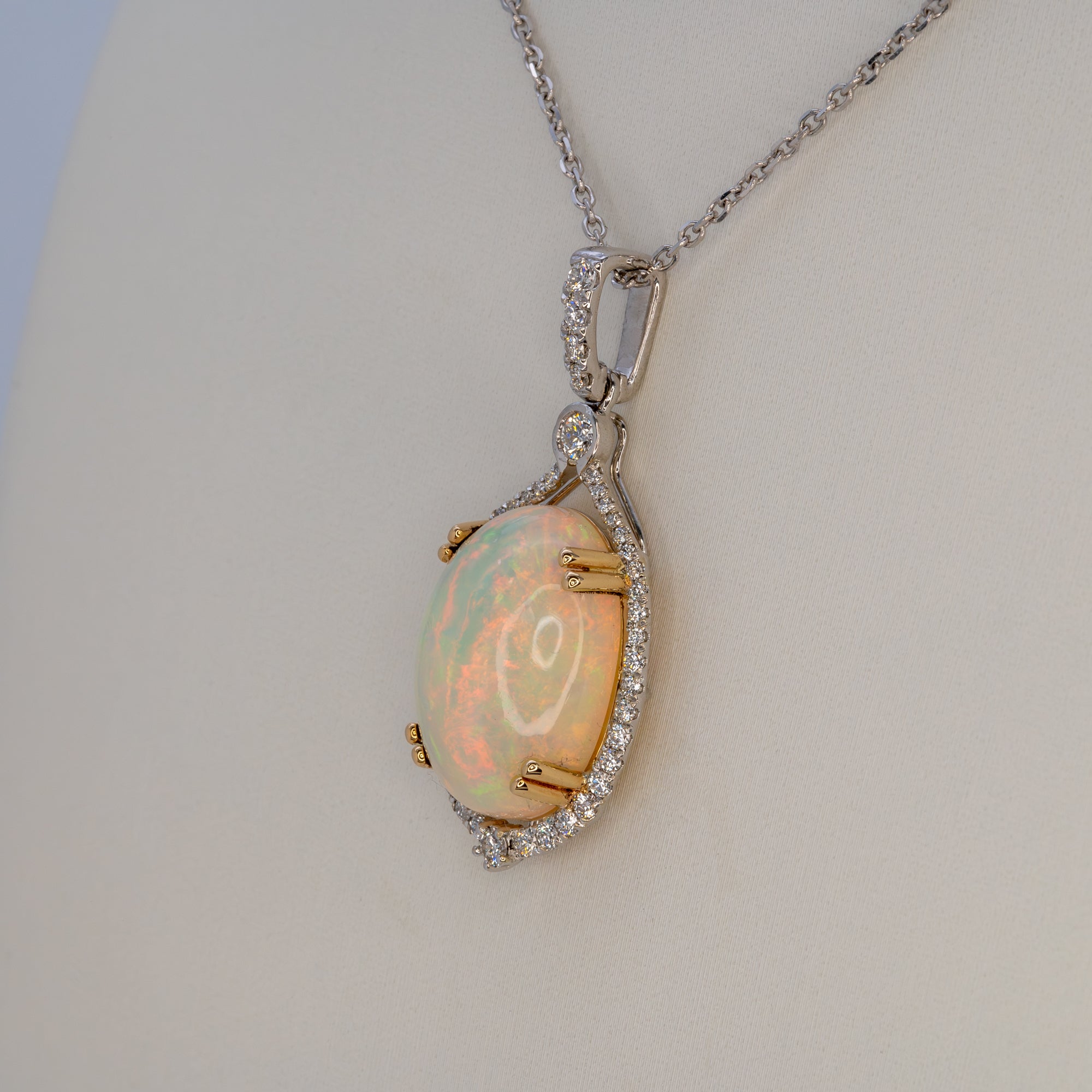 14K white & yellow gold ethiopian opal pendant with diamond accents