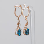 14K rose gold London blue topaz oval earrings with diamond accents