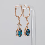 14K rose gold London blue topaz oval earrings with diamond accents