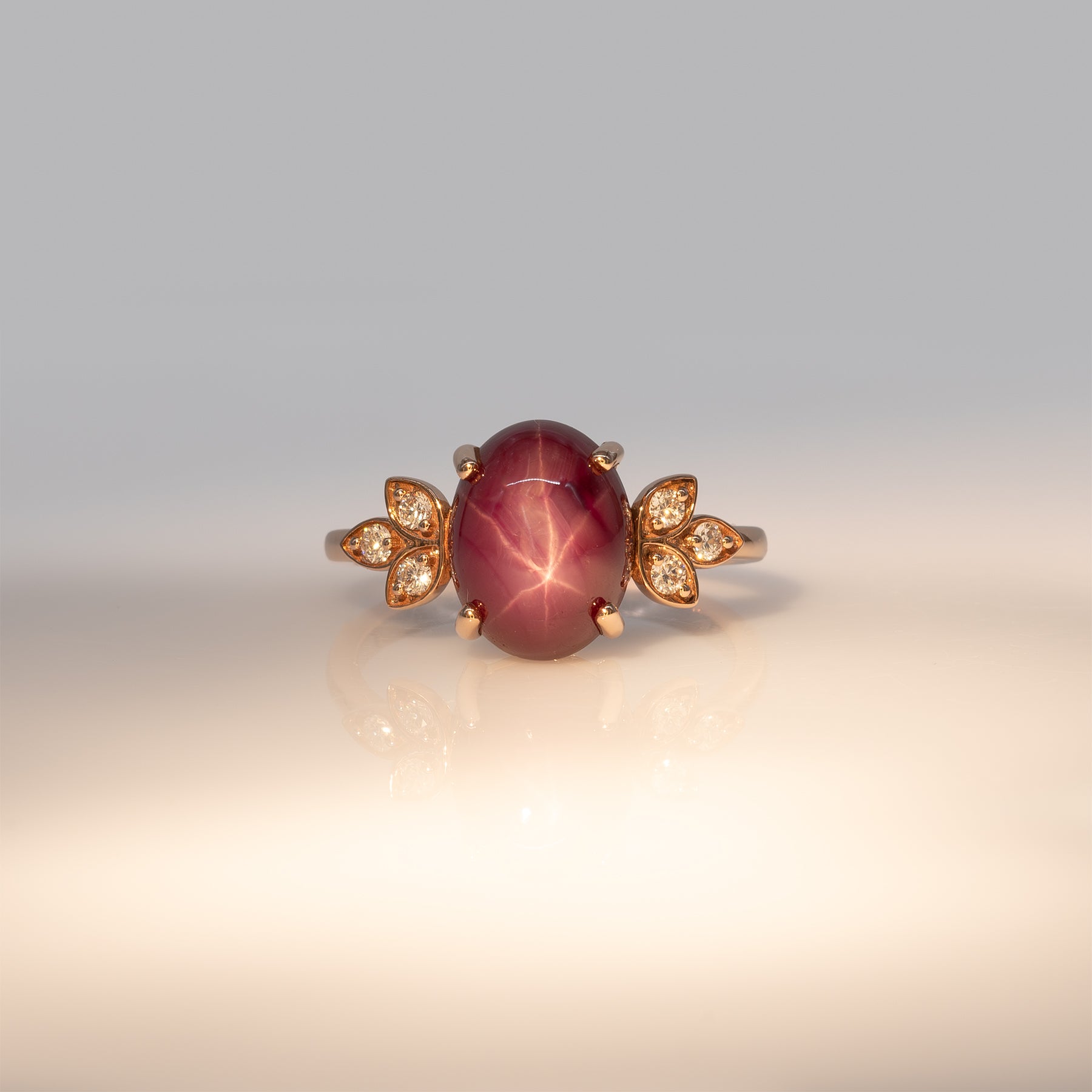 14K rose gold star ruby cabochon ring with diamond accents