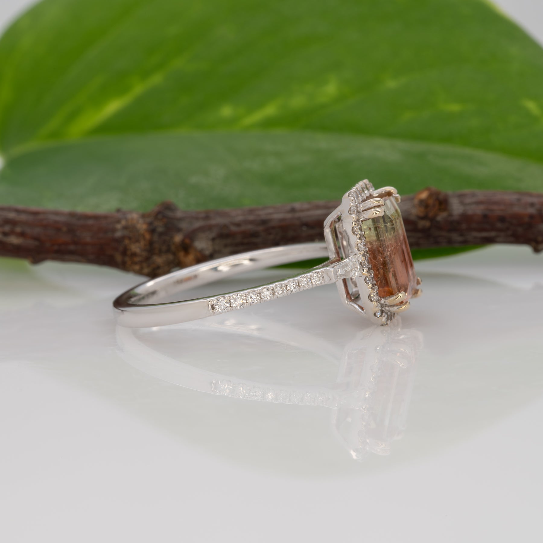 14K white gold bi-color tourmaline emerald-cut ring with diamond halo
