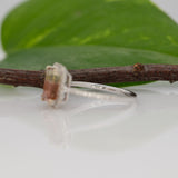 14K white gold bi-color tourmaline emerald-cut ring with diamond halo